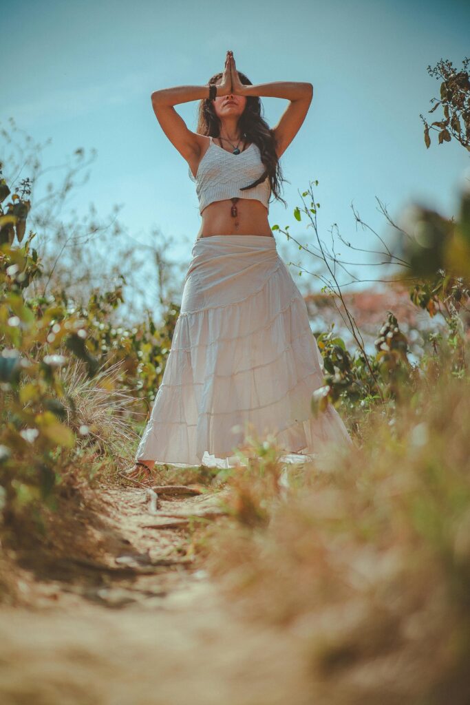 Woman in White Tank Crop Top on Grass Field